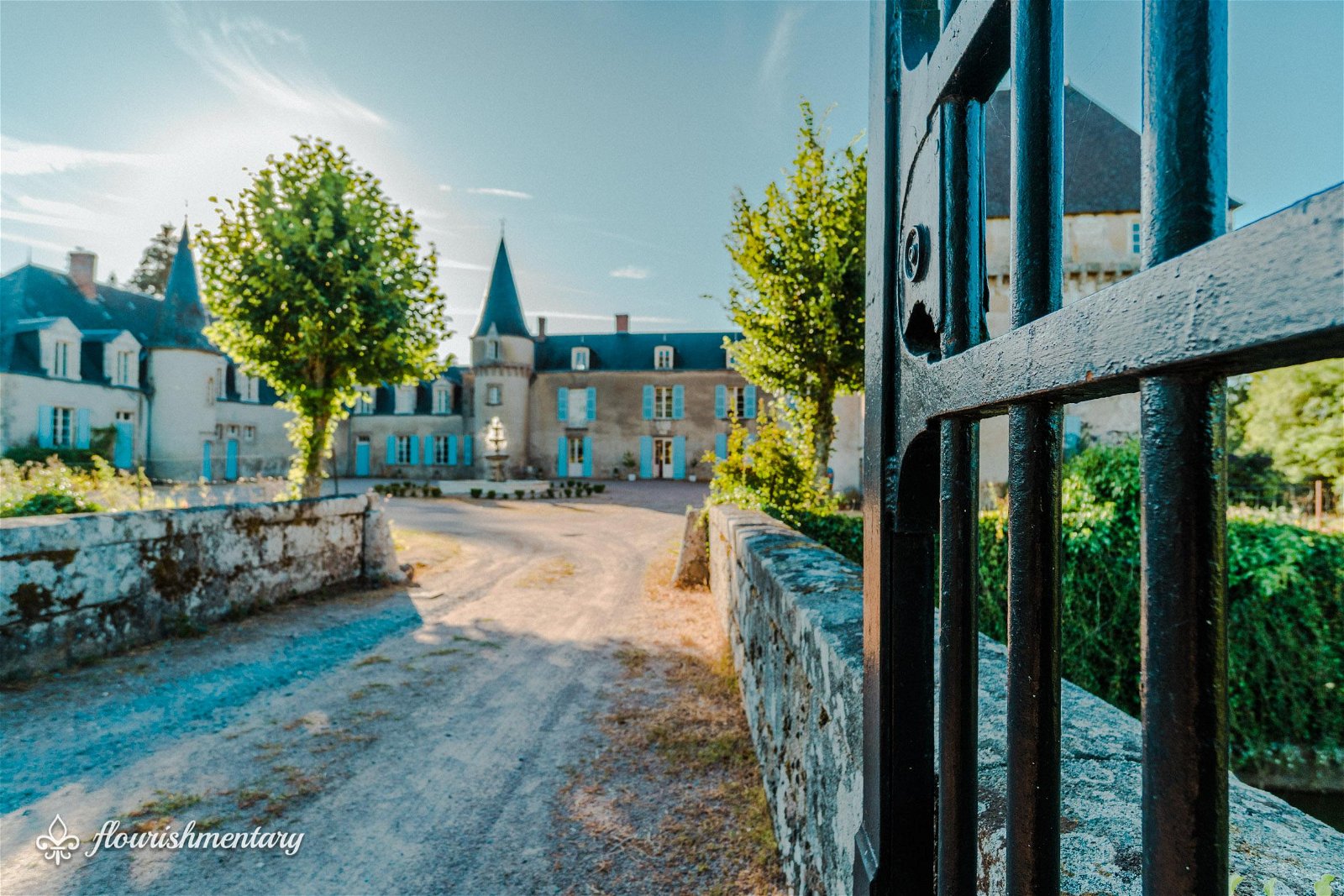 the small bridge over the moat at chateau de lalande